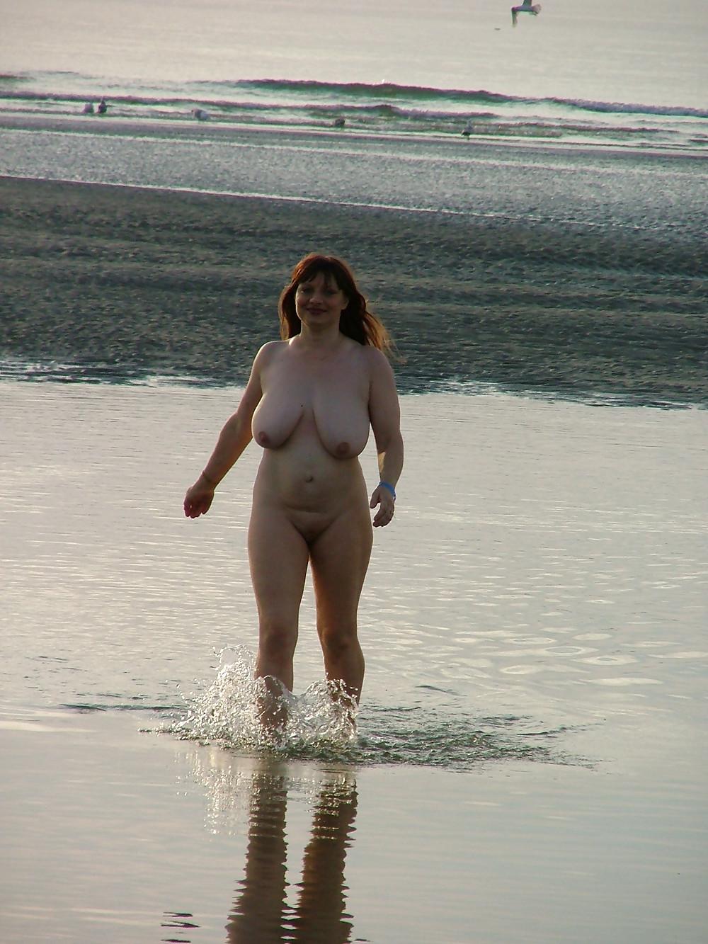 24P Busty women at the beach.
