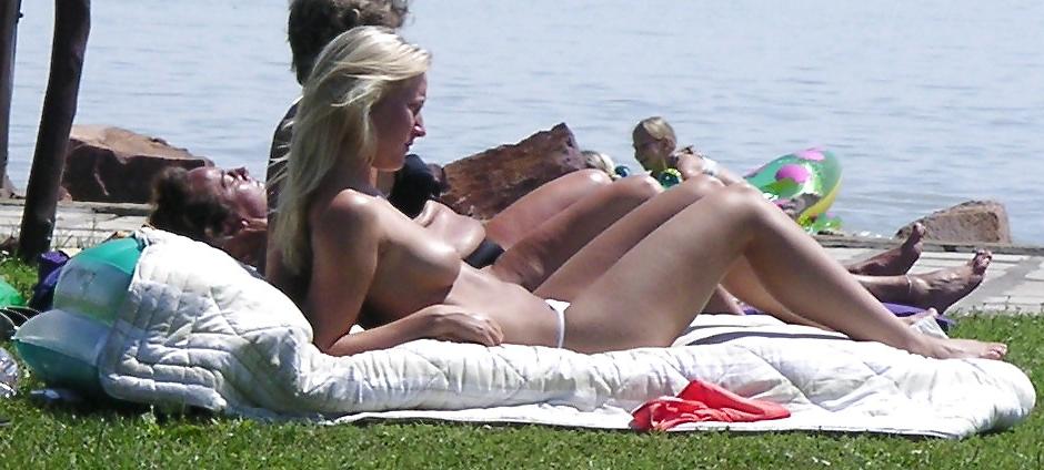 25P Voyeurpics of topless danish blonde on Hungarian beach