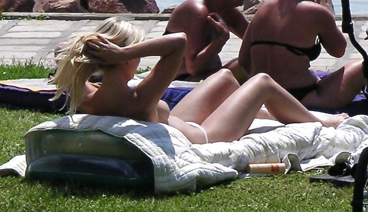 25P Voyeurpics of topless danish blonde on Hungarian beach