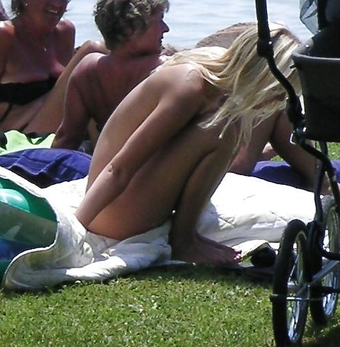 25P Voyeurpics of topless danish blonde on Hungarian beach