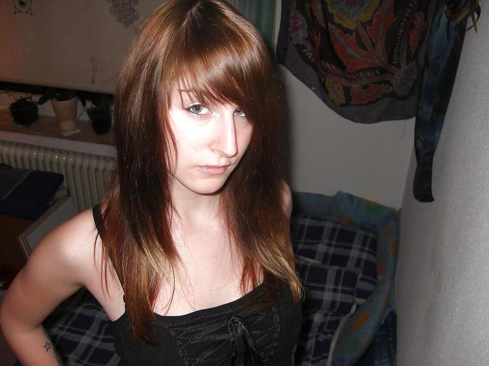 25P Snotty faced college girl with terrible tattoos.