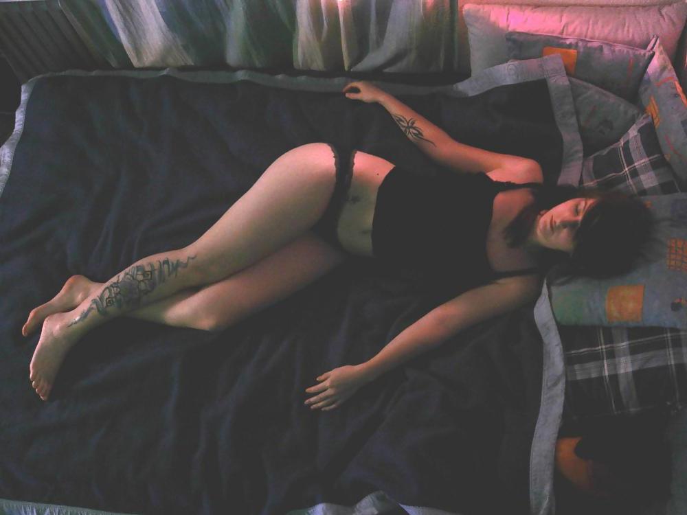 25P Snotty faced college girl with terrible tattoos.