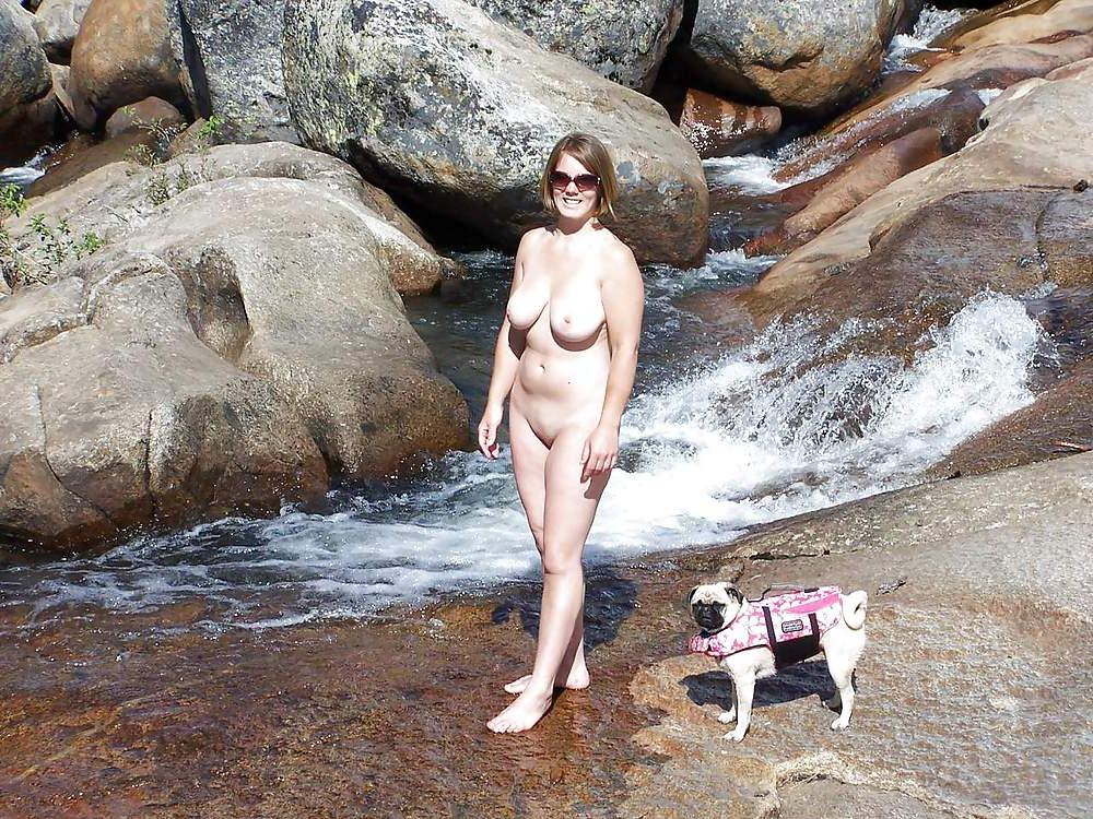 25P Nudist woman by the waterfall
