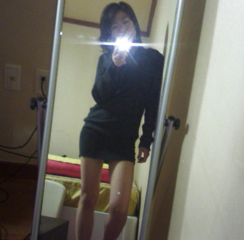 8P Korean milf takes self pics