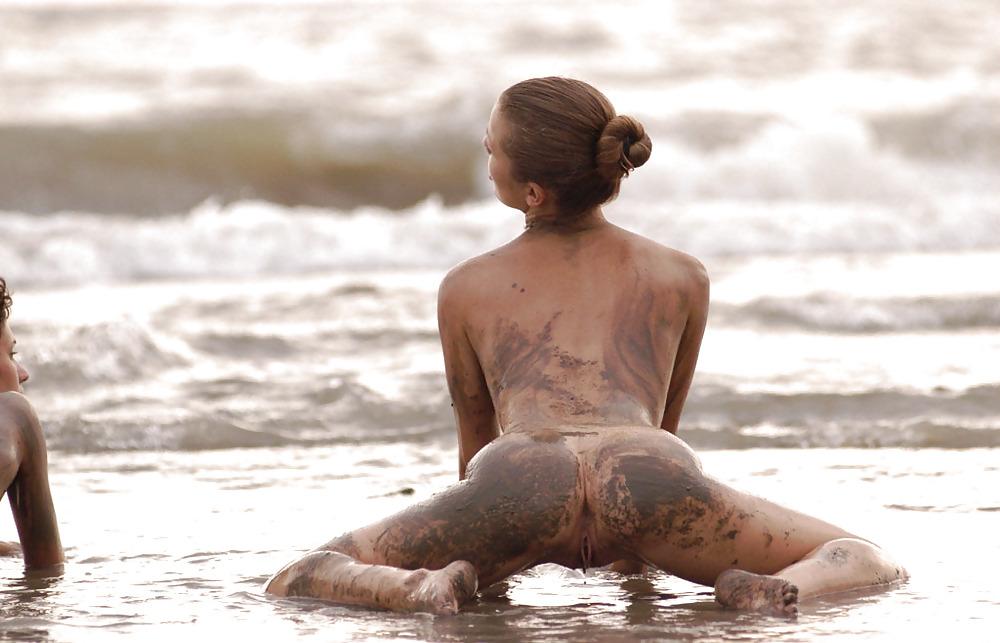 16P Two hotties getting muddy on the beach