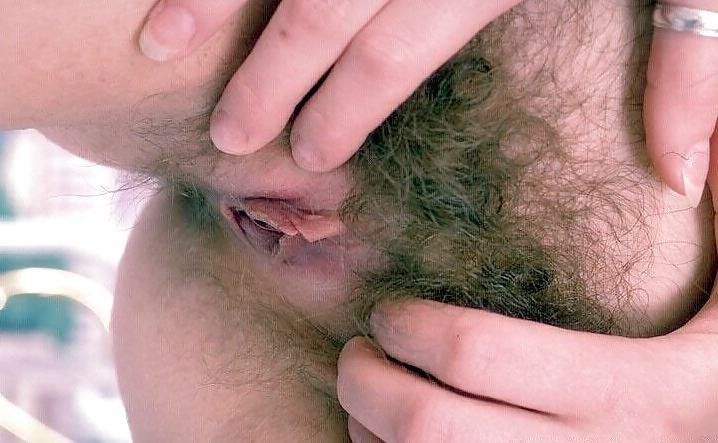 25P Hairy brunette Angie posing