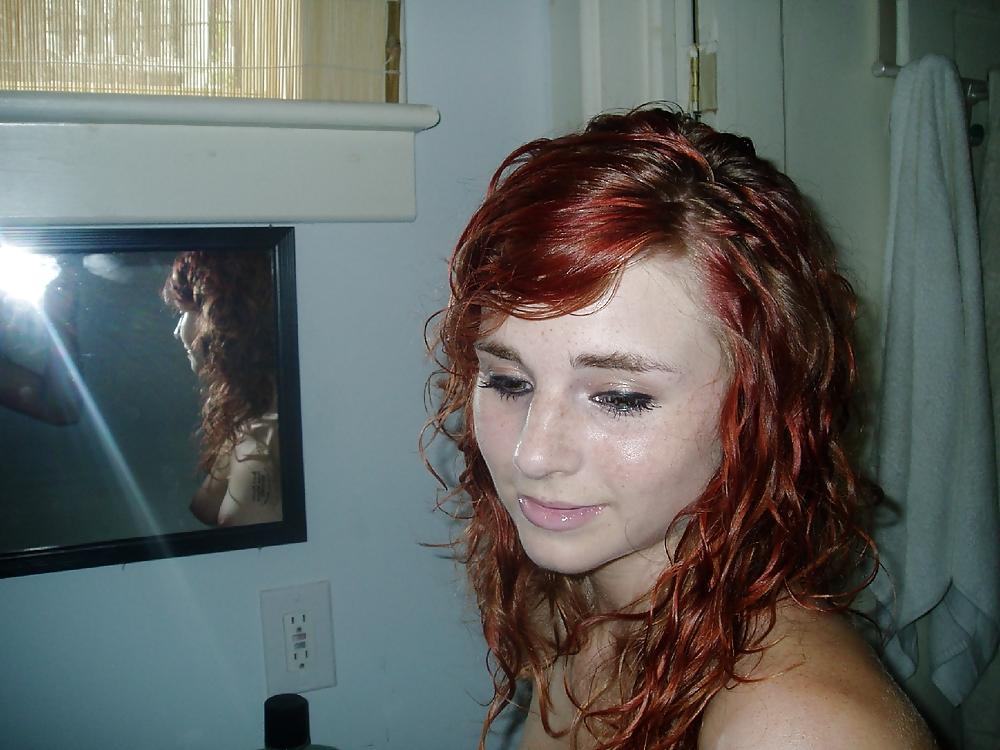 25P Young redhead in pants and nacked