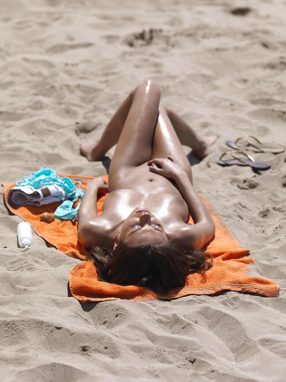 25P Sexy young girl naked on the beach