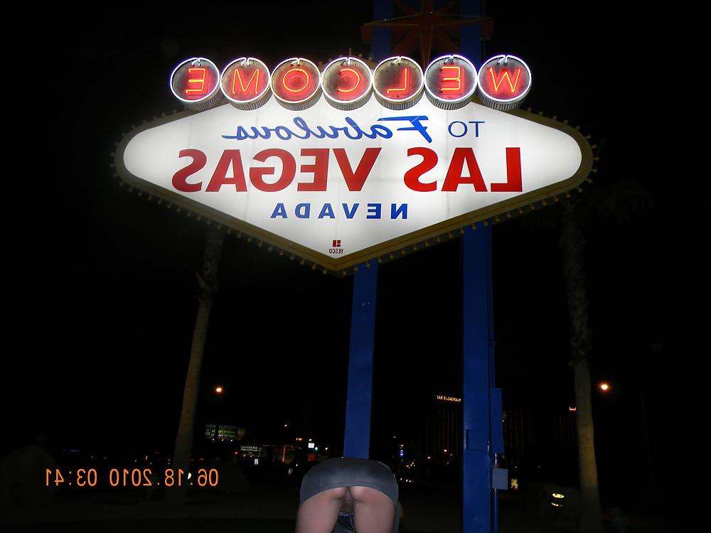 12P NINA latina flashing at the Las Vegas sign