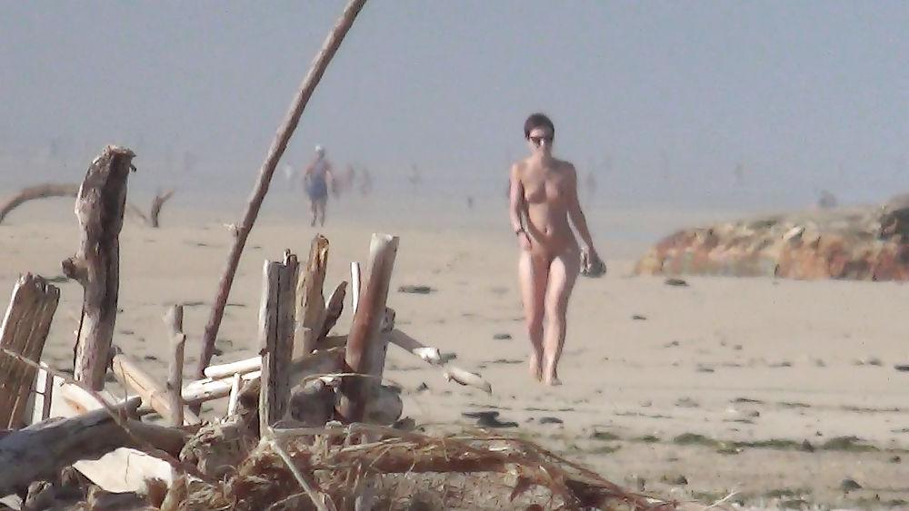 13P Nude girl walking on european beach