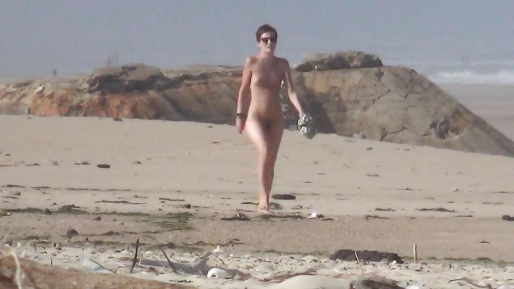 13P Nude girl walking on european beach