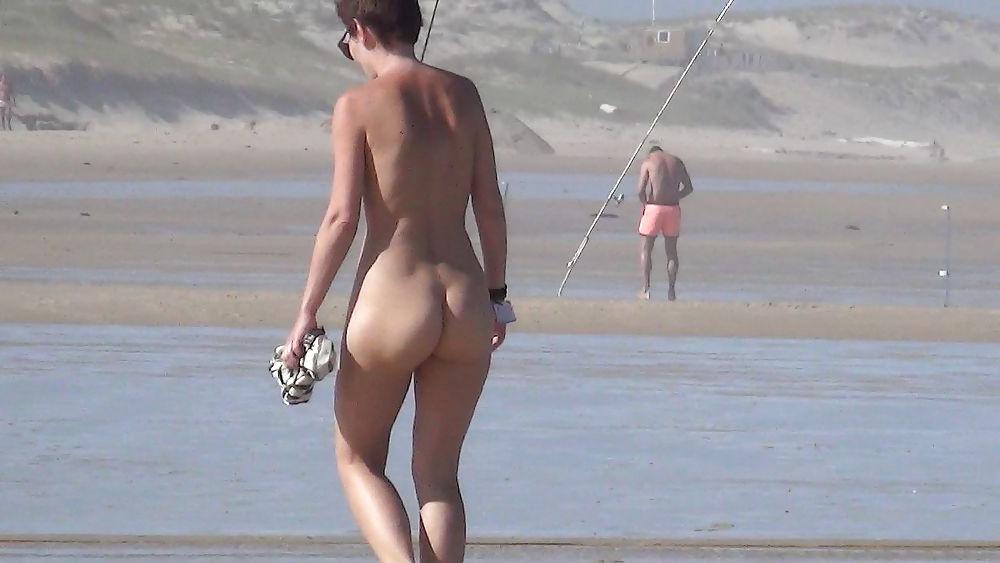 13P Nude girl walking on european beach