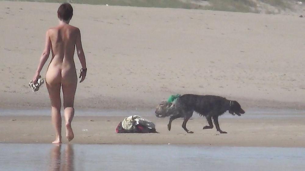 13P Nude girl walking on european beach