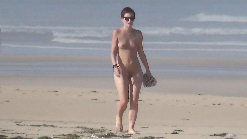 13P Nude girl walking on european beach