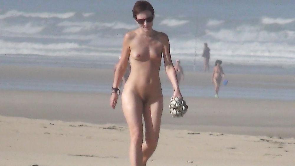 13P Nude girl walking on european beach