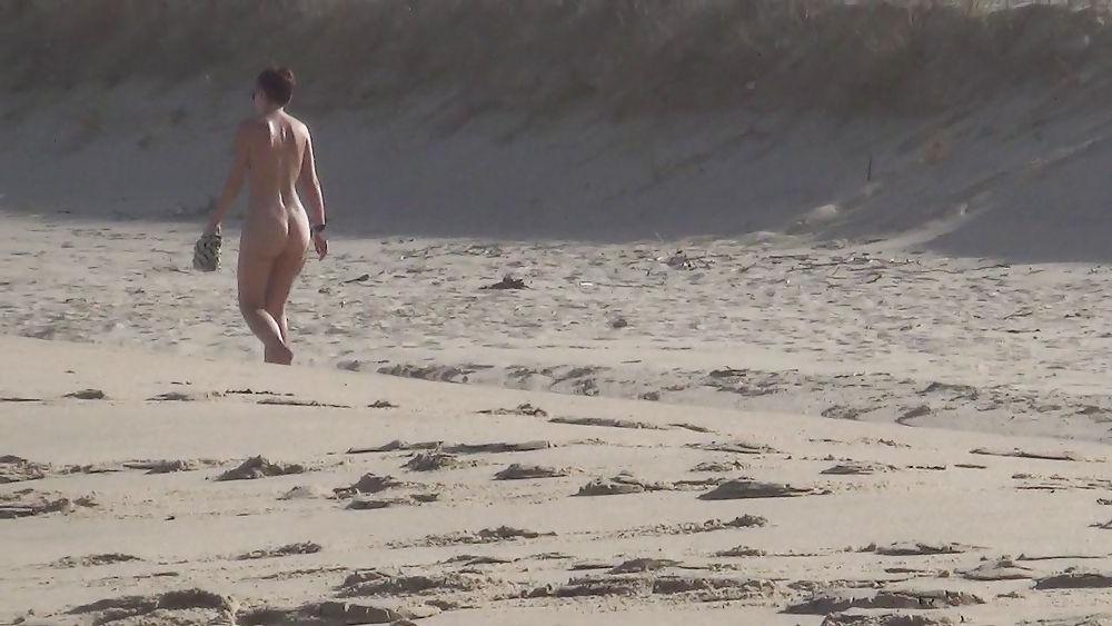 13P Nude girl walking on european beach
