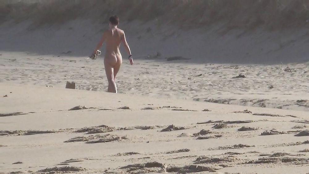 13P Nude girl walking on european beach