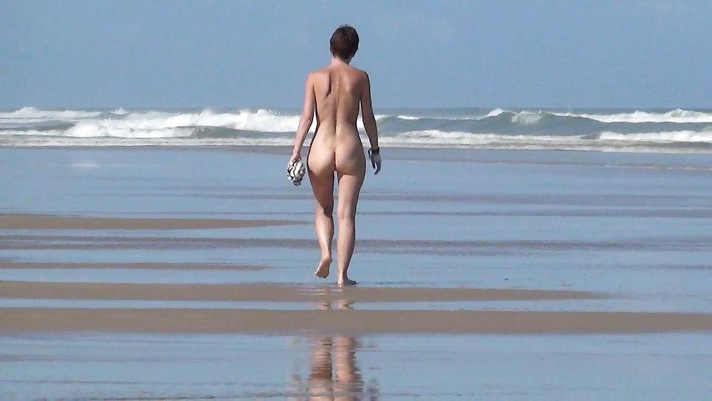 13P Nude girl walking on european beach