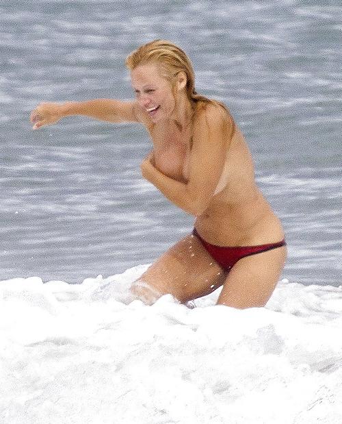 11P Pamela Anderson Goes Topless on a Beach in France