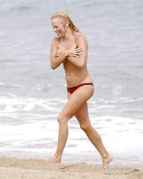 11P Pamela Anderson Goes Topless on a Beach in France