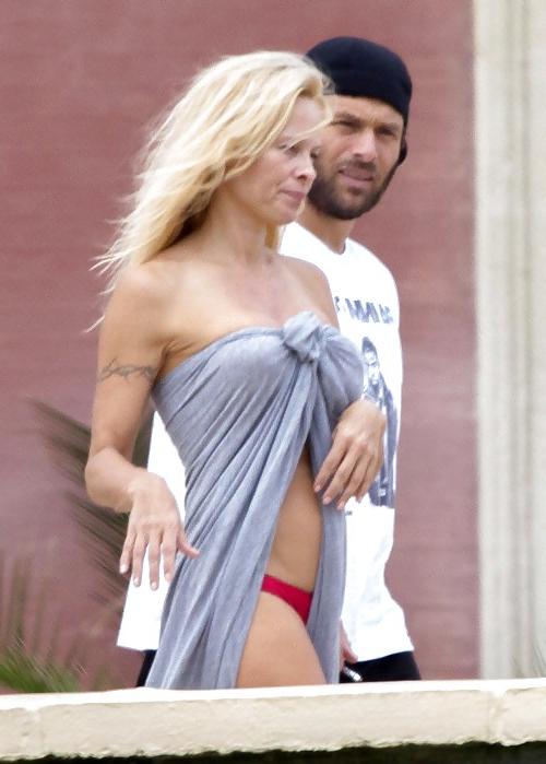 11P Pamela Anderson Goes Topless on a Beach in France
