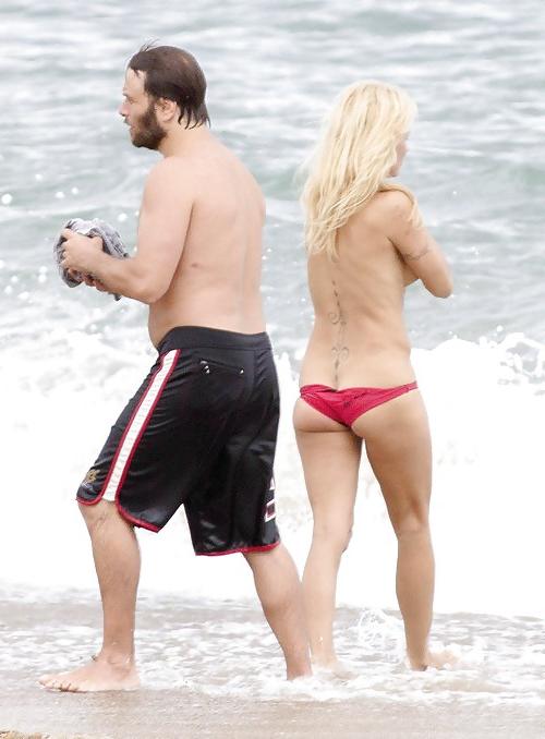 11P Pamela Anderson Goes Topless on a Beach in France