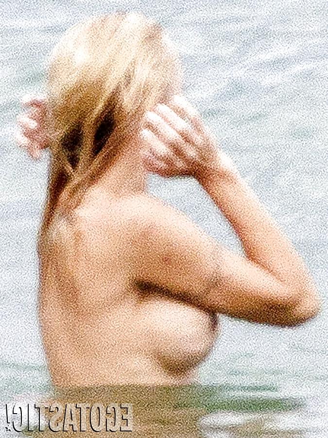 11P Pamela Anderson Goes Topless on a Beach in France