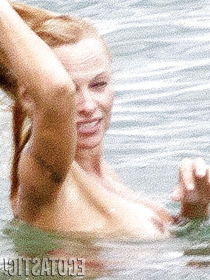 11P Pamela Anderson Goes Topless on a Beach in France