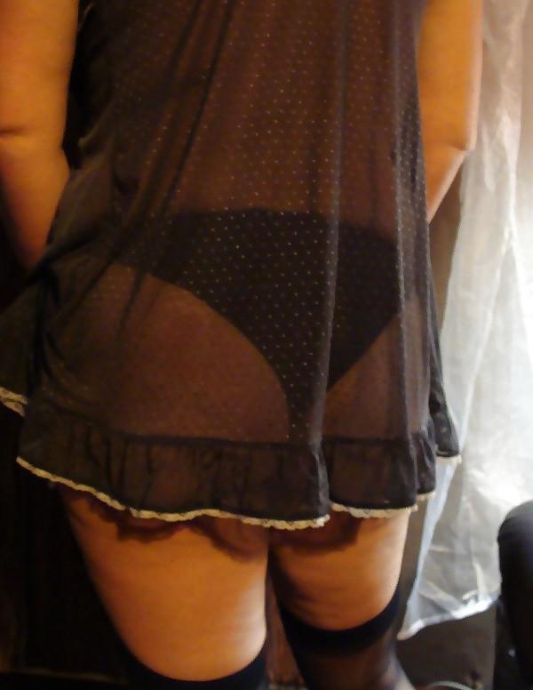 14P Mature woman in stockings and garter belt