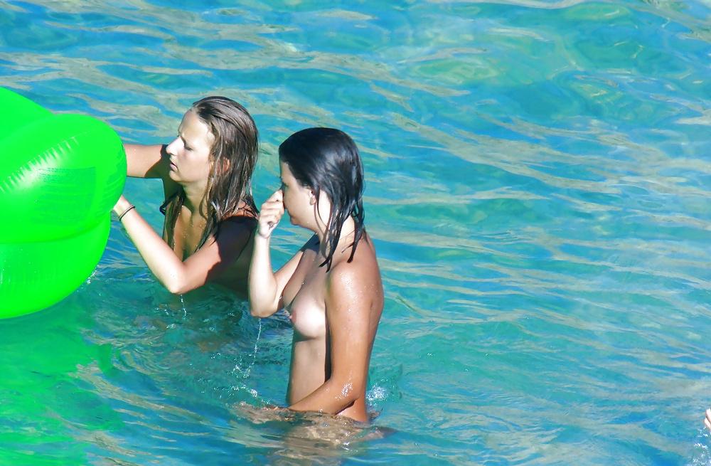 25P Hot sluts nude on the Beach Voyeur