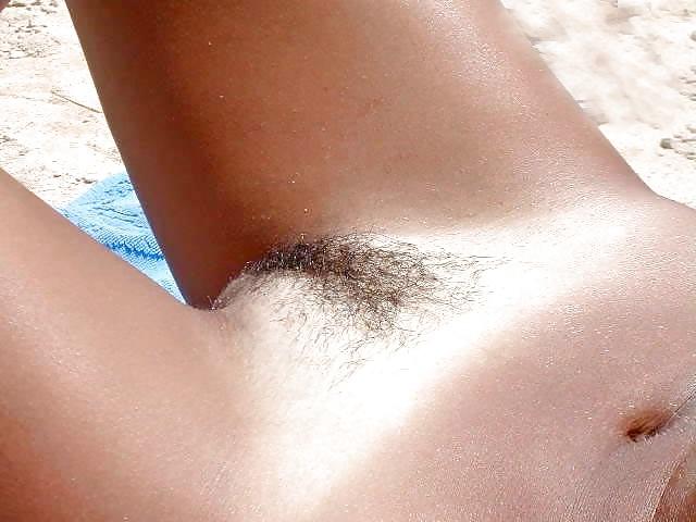 25P Pussies lying on the beach