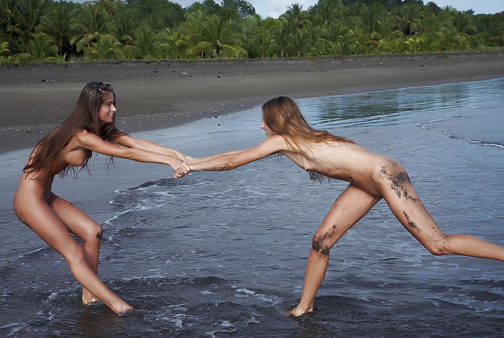 14P Two nudists getting dirty at the beach