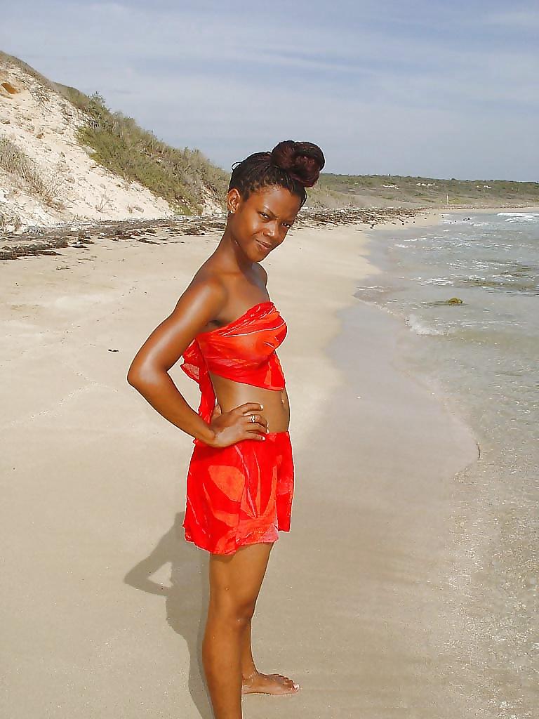 25P Displaying young ebony crack on the beach...Part 1