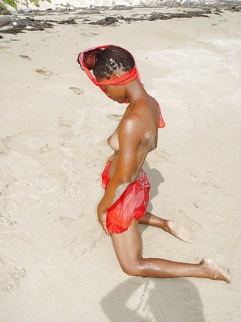 25P Displaying young ebony crack on the beach...Part 1