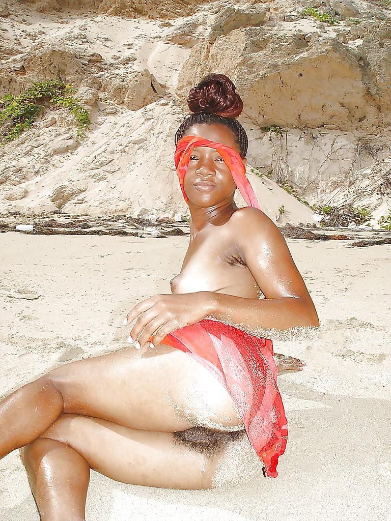 25P Displaying young ebony crack on the beach...Part 1