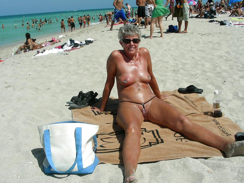 13P Beautiful mature woman in mini bikini