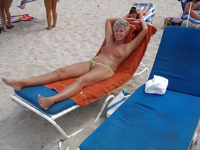 13P Beautiful mature woman in mini bikini