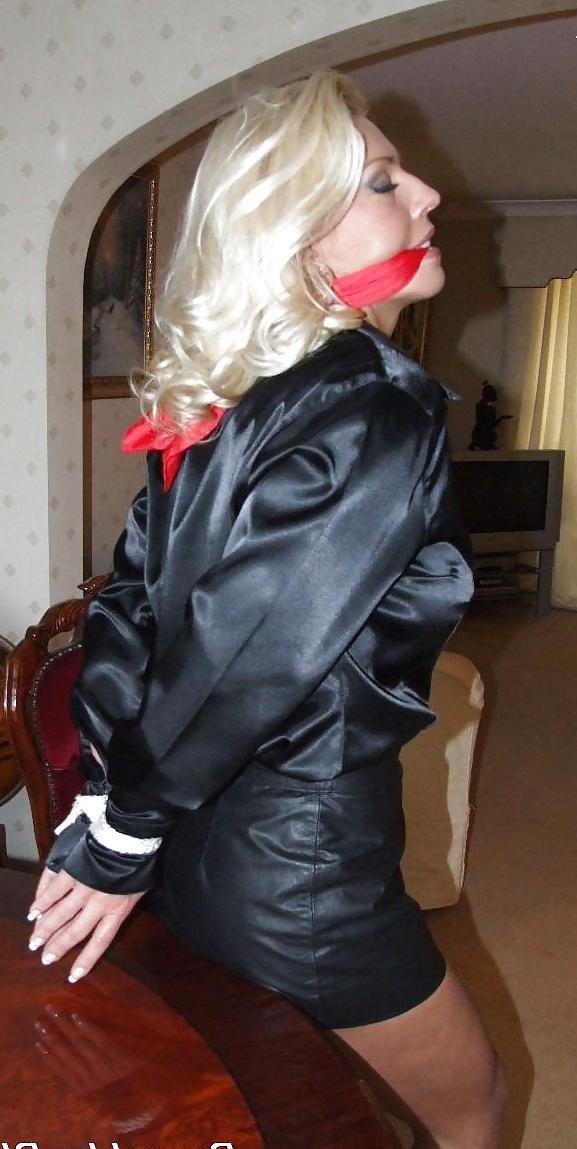 25P Blonde tied up wearing leather skirt and high heels