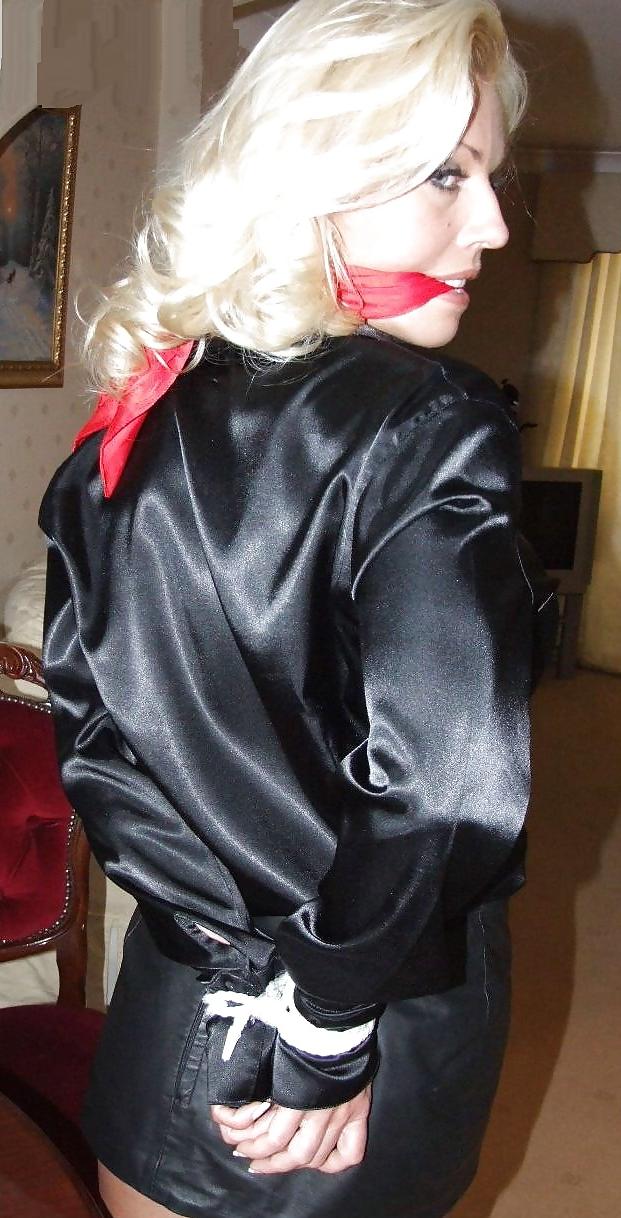 25P Blonde tied up wearing leather skirt and high heels