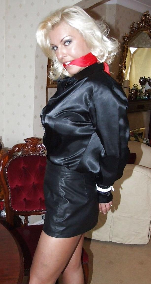 25P Blonde tied up wearing leather skirt and high heels
