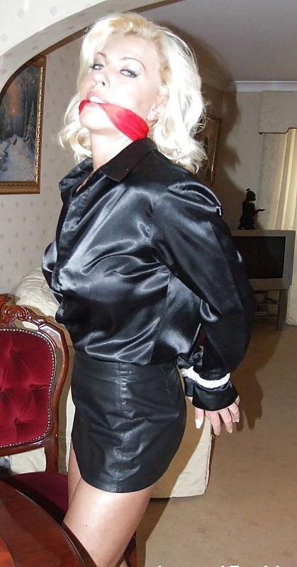 25P Blonde tied up wearing leather skirt and high heels