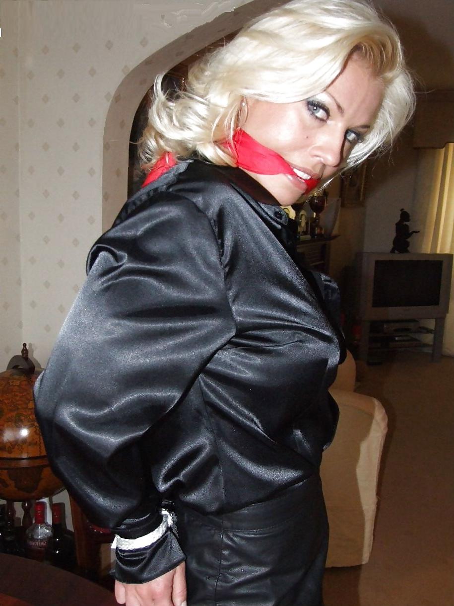 25P Blonde tied up wearing leather skirt and high heels