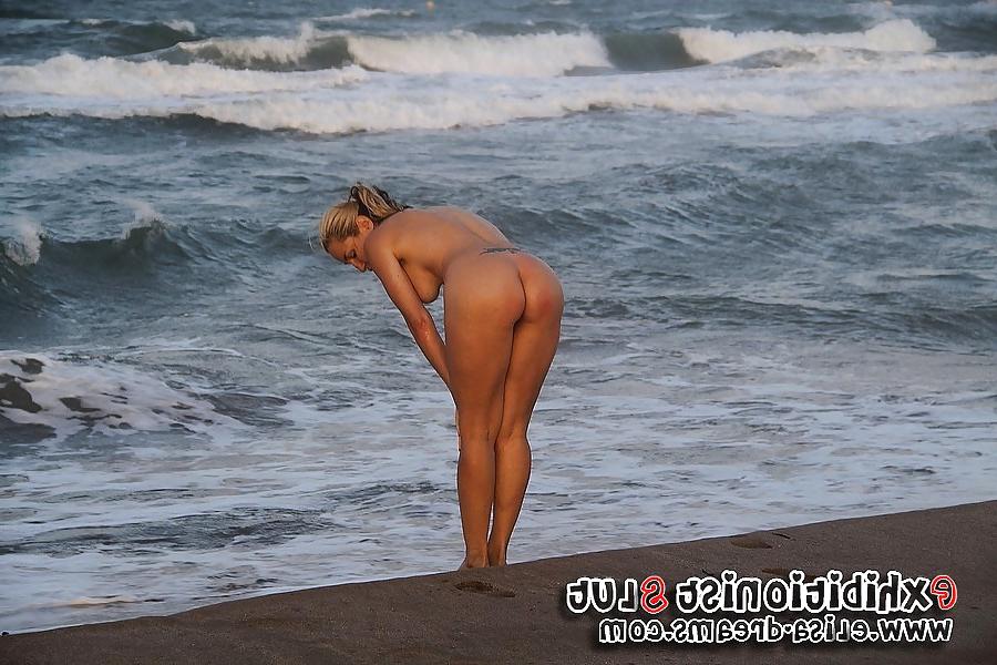 10P Flashing and nude on the beach playing with a black toy
