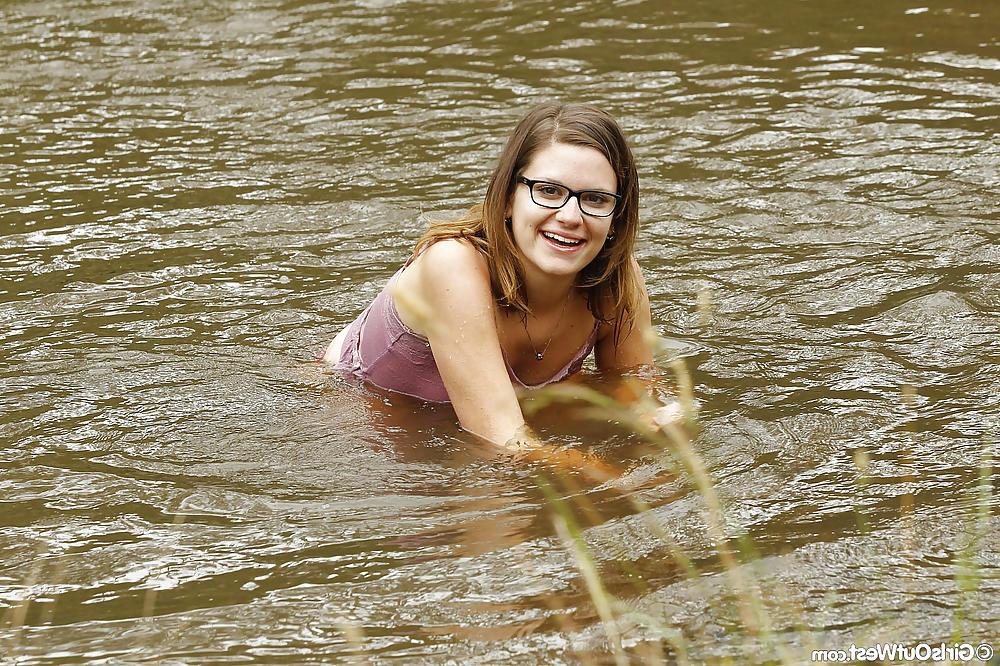 16P Small titted babe fingers her hairy pussy outdoors