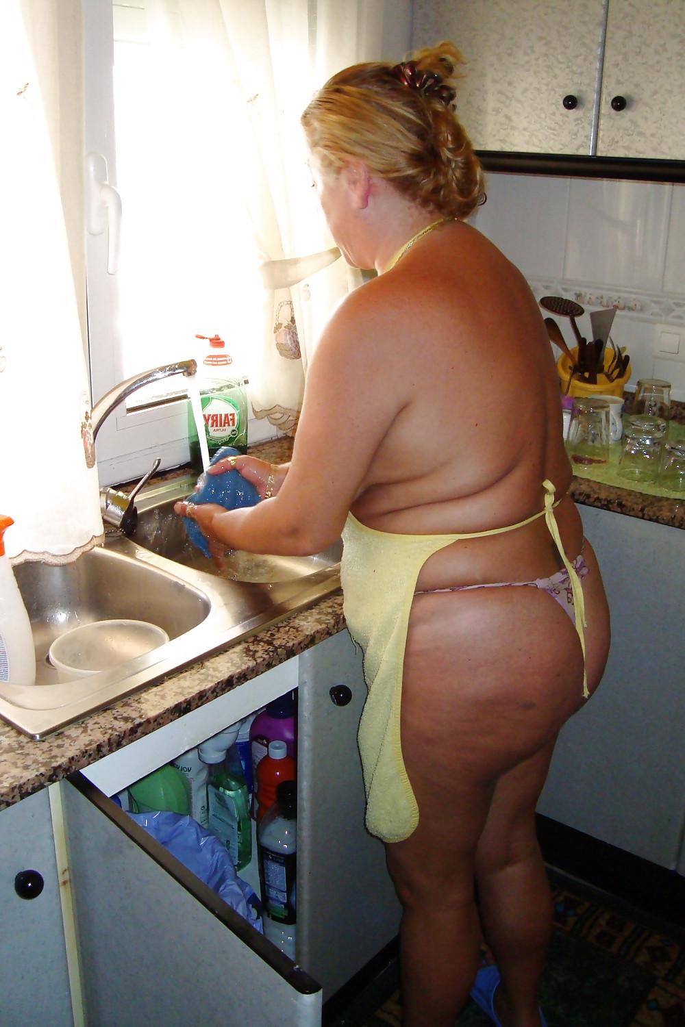 16P A beautiful mature woman in the kitchen