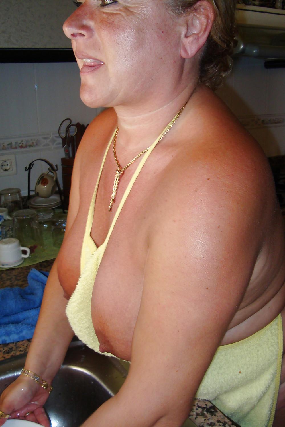 16P A beautiful mature woman in the kitchen