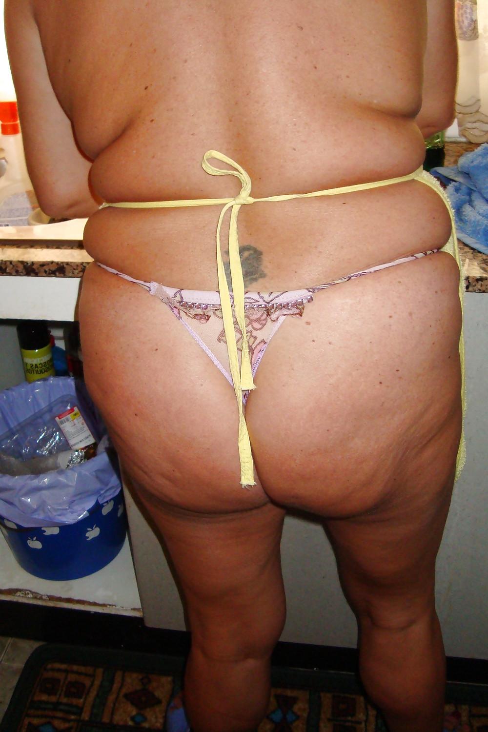 16P A beautiful mature woman in the kitchen