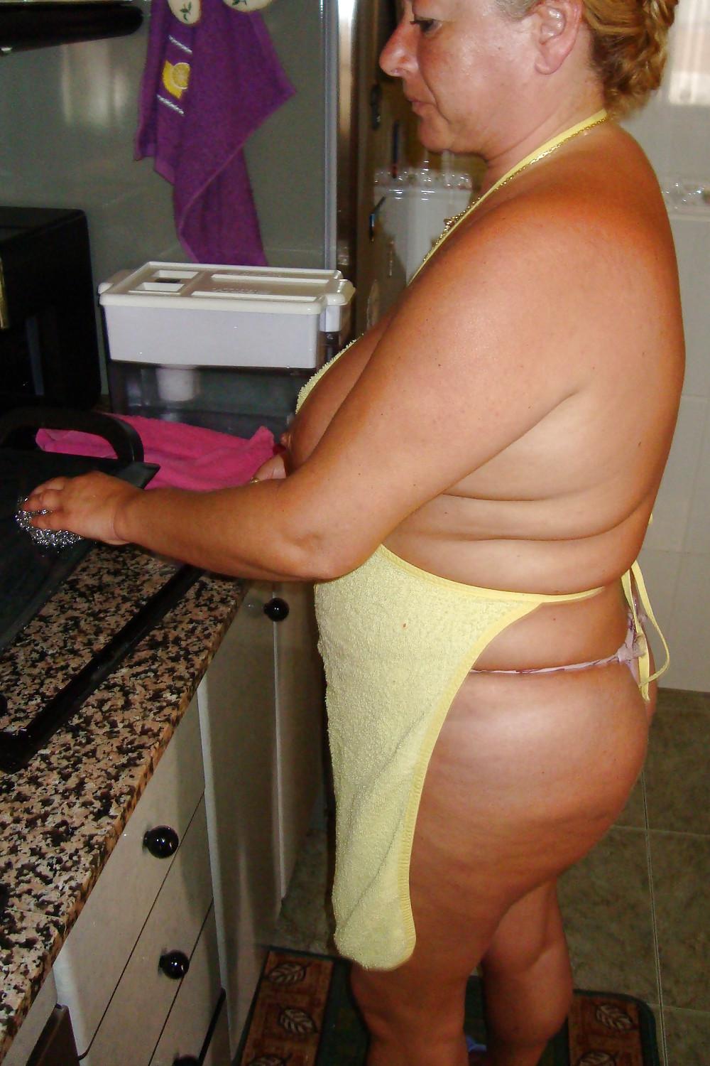 16P A beautiful mature woman in the kitchen