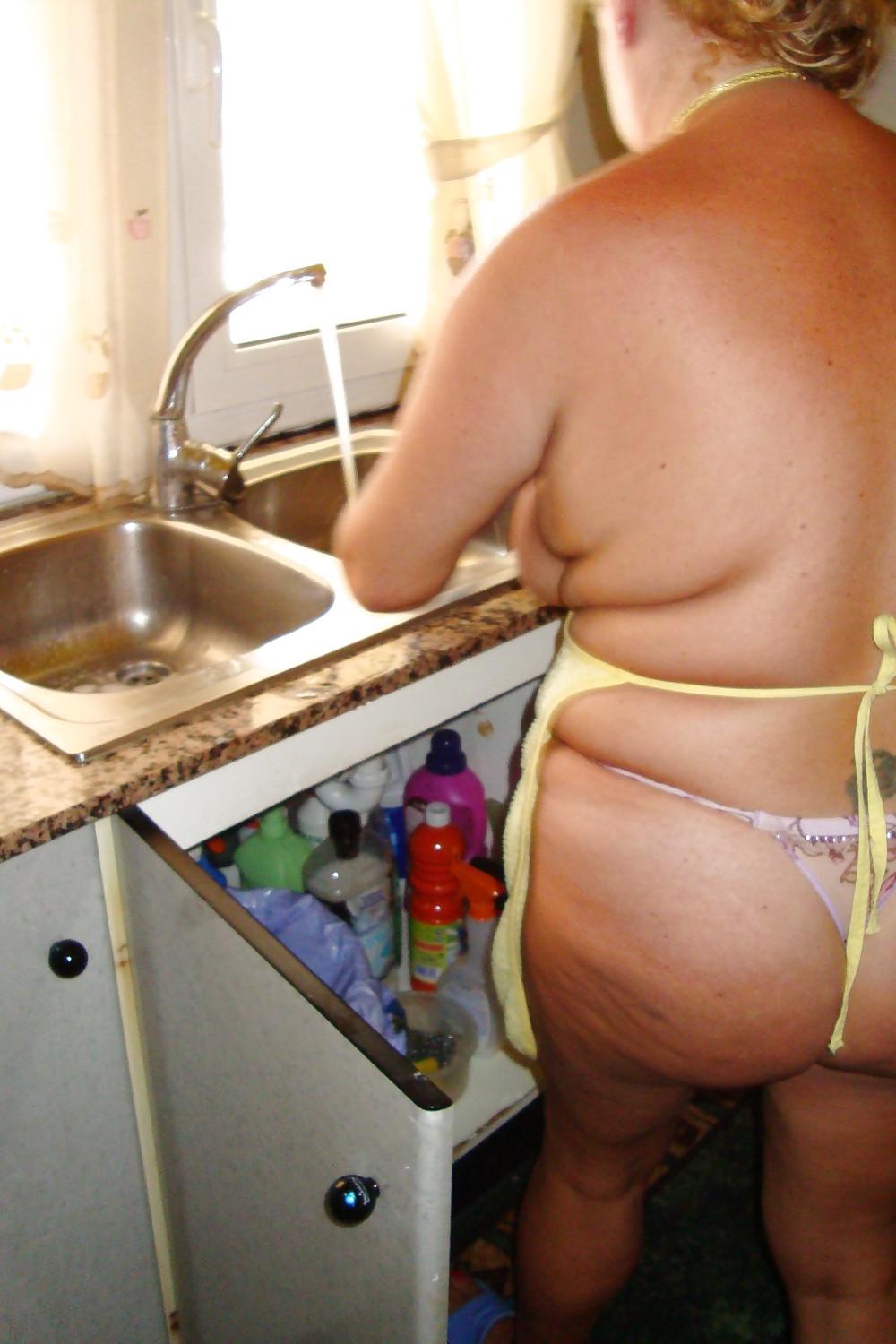 16P A beautiful mature woman in the kitchen