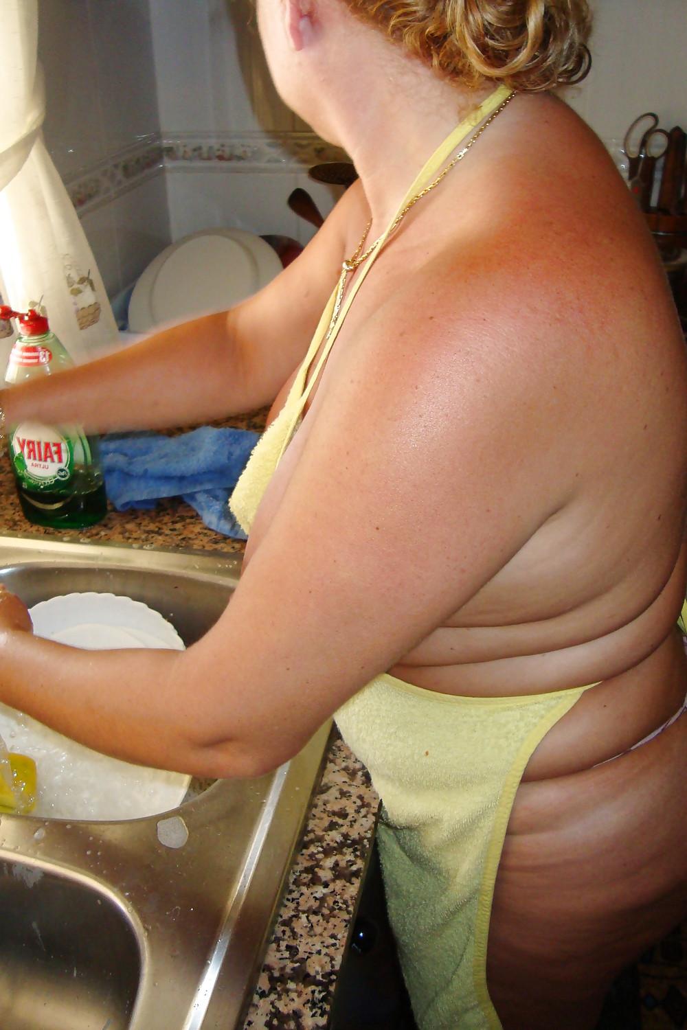 16P A beautiful mature woman in the kitchen
